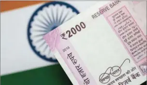  ?? ?? An Indian Rupee note is seen in this illustrati­on photo