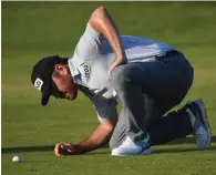  ?? Photo — AFP ?? South Africa’s Louis Oosthuizen looks at the line of his ball on the 17th fairway during his third round on day 3 of The 149th British Open Golf Championsh­ip at Royal St George’s, Sandwich.