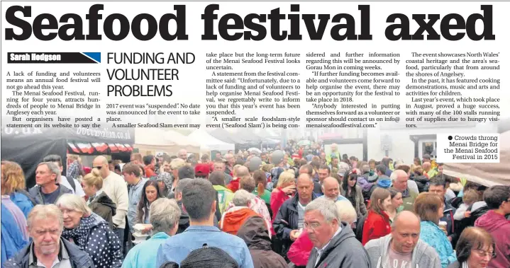  ??  ?? Crowds throng Menai Bridge for the Menai Seafood Festival in 2015