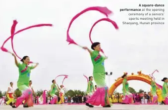  ??  ?? A square-dance performanc­e at the opening ceremony of a seniors' sports meeting held in Shaoyang, Hunan province