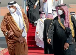  ?? AP ?? Saudi Arabia’s Crown Prince Mohammed bin Salman, right, welcomes Qatar’s Emir Sheikh Tamim bin Hamad alThani upon his arrival to attend the Gulf Cooperatio­n Council’s 41st Summit in AlUla, Saudi Arabia.