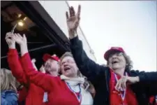  ?? ANDREW HARNIK — THE ASSOCIATED PRESS ?? Members of the audience cheer as President Donald Trump arrives for a rally at Southern Illinois Airport in Murphysbor­o, Ill., Saturday.