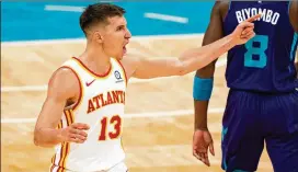  ?? JACOB KUPFERMAN/TNS ?? Bogdan Bogdanovic reacts to a call against the Hornets during the fourth quarter Sunday. Bogdanovic scored a season-high 32 points in the game.