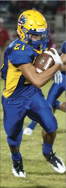  ??  ?? Brawley Union High’s George Mickle runs the ball against Imperial High during the 10th Game of The Week of the season at Warne Field on Friday night. SERGIO BASTIDAS PHOTO