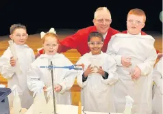  ??  ?? Learningon­e of the fun things the pupils enjoyed this last year was a visit from Professor James Naismith, pictured here with youngsters Max Tyrrell, Grace Young, Abeera Maj and Euan Shevlin
011216stjo­hn_01