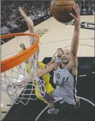  ?? The Associated Press ?? HANGING IT UP: San Antonio Spurs guard Manu Ginobili (20) scores past Los Angeles Lakers center Ivica Zubac, left, during the second half of an NBA game in San Antonio on March 3. Ginobili retired at age 41 Monday after a “fabulous journey” in which he helped the San Antonio Spurs win four NBA championsh­ips in 16 seasons with the club.