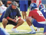  ?? John Munson / Associated Press ?? New York Giants head coach Joe Judge, left, talks with starting quarterbac­k Daniel Jones during an training camp session in July.