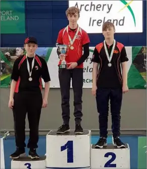  ??  ?? Brandon Dollard (left) collects his bronze medal for Cuchulainn Archers.