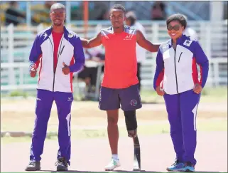  ?? Photo: Nampa ?? Optimistic … Secretary general of the Namibia Paralympic Committee (NPC) Michael Hamukwaya (left) with some athletes.