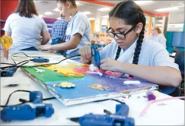  ?? RECORDER PHOTOS BY CHIEKO HARA ?? Maritza Ramos Leon, 12, works on a self-portrait Thursday, June 14, during Girl Code camp at the Future Ready Lab. The three-day camp encouraged girls to explore careers in computer science and technology fields.