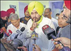  ?? PTI ?? Punjab Congress chief Navjot Singh Sidhu after meeting party leaders KC Venugopal and Harish Rawat (left) at the All
India Congress Committee headquarte­rs in New Delhi on Thursday.