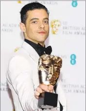  ?? Pascal Le Segretain Getty Images ?? RAMI MALEK wins for lead actor in “Bohemian Rhapsody,” a victory he called “truly extraordin­ary.”