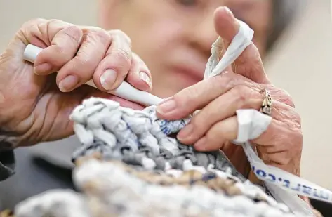  ??  ?? Top: Jean White crochets “plarn” into blankets for homeless people earlier this month at Gloria Dei Lutheran Church.