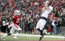  ?? JULIO CORTEZ — THE ASSOCIATED PRESS ?? Penn State’s Pat Freiermuth, right, catches a touchdown pass from Trace McSorley as Rutgers’ Avery Young, left, defends Saturday in Piscataway, N.J.