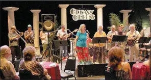  ?? Democrat-Gazette file photo/HELAINE R. WILLIAMS ?? The Greasy Greens performed at the 2018 Wine &amp; Food FEASTival at Wildwood Park for the Arts.