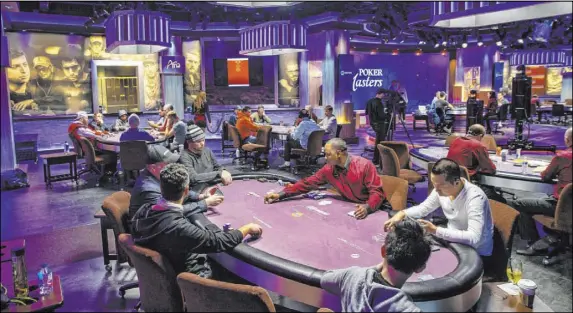  ?? L.E. Baskow Las Vegas Review-Journal @Left_Eye_Images ?? Play continues on sides as well as the main table during the Poker Masters 2019 broadcast Nov. 19 at the PokerGo Studio at the Aria.