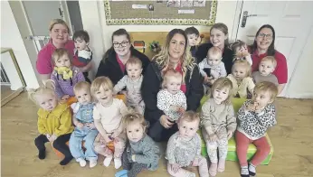  ?? ?? Staff and children at the Little Acorns baby and day nursery at Yaxley which received an outstandin­g Ofsted