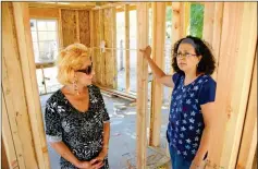  ??  ?? DEE FUGATE (LEFT) HAS been living in the shed behind her old home that burned down in November 2014. Here she stands with Yira Hoffman, the Yuma Southwest Contractor­s Associatio­n board member who spearheade­d the effort to build Fugate a new home on the...