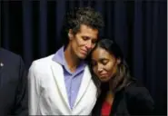  ?? MATT SLOCUM — THE ASSOCIATED PRESS ?? Bill Cosby accuser Andrea Constand embraces prosecutor Kristen Feden, right, during a news conference after Cosby was found guilty on April 26 in Norristown.