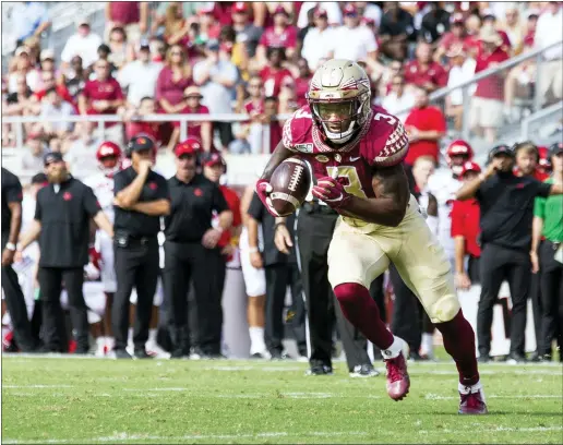  ?? MARK WALLHEISER — THE ASSOCIATED PRESS ?? Florida State running back Cam Akers (3) has 17runs of at least 10yards through four games,