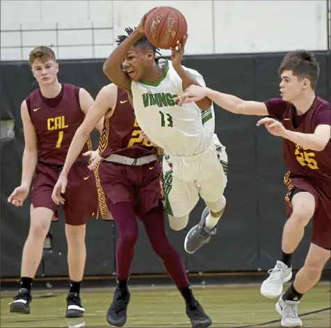  ?? Pam Panchak/Post-Gazette ?? Sto-Rox’s Marcus Upshaw leaps around California’s Tyler Kniha and Derrick Hammitt to make a pass in a WPIAL Class 2A game Saturday at Keystone Oaks High School.