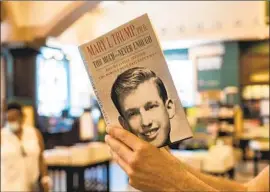  ?? Ron Adar SOPA I mages ?? A NEW YORK bookstore patron reads Mary Trump’s bestseller about her uncle. “Fraud was not just the family business — it was a way of life,” her lawsuit states.