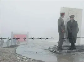  ?? HT FILE ?? Chinese army personnel stand guard at Nathu La. Faceoff between the two neighbours erupted in early June in an area along SikkimBhut­an border, which China calls Donglang.