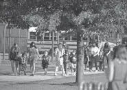  ?? COURTNEY HERGESHEIM­ER/ COLUMBUS DISPATCH ?? Students arrive at Avondale Elementary School Thursday on the first day of school for Columbus City Schools. Of the district’s 20 schools that were not able to begin in-person classes on Thursday due to lack of air conditioni­ng, all but one will resume in-person learning on Monday.