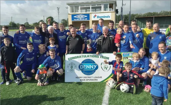  ??  ?? Killarney Athletic’s captain Conor Farrell holds the Greyhound Bar Cup after the presentati­on in their win over Mitchels Avenue in Mounthawk Park Tralee on Sunday last.