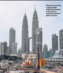  ??  ?? Malaysia is expecting a bigger budget deficit than expected in 2015 amid a continuing decline in global oil prices.