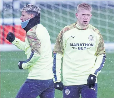  ?? AFP ?? Manchester City striker Sergio Aguero, left, and midfielder Kevin De Bruyne attend a training session yesterday.