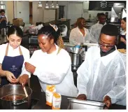  ?? ?? Students from Zimbabwean universiti­es who visited Spain, courtesy of Tourism and Hospitalit­y Industry patron First Lady Dr Auxillia Mnangagwa, being taught how to prepare different types of dishes at the Basque Culinary Centre in Donostia, San Sabastian, Spain, yesterday