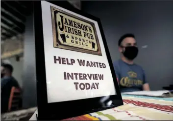  ?? PHOTO/MARCIO JOSE SANCHEZ ?? A hiring sign is shown at a booth for Jameson’s Irish Pub during a job fair in 2021 in the West Hollywood section of Los Angeles.