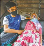  ?? (AP/Ajit Solanki) ?? A covid-19 patient waits in an autoricksh­aw to be attended to and admitted into a dedicated covid-19 government hospital in Ahmedabad, India.