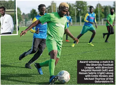  ??  ?? Award-winning: a match in the Diversity Football League, with directors Mujahid Hamidi (left) and Hassan Sabrie (right) along with Emile Heskey and Michael Thurlow of the Oxfordshir­e FA