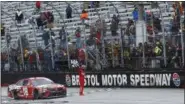  ?? WADE PAYNE — ASSOCIATED PRESS ?? Kyle Busch celebrates with fans after winning a NASCAR Cup Series auto race, Monday in Bristol, Tenn.