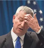  ?? DREW ANGERER, GETTY IMAGES ?? New York Mayor Bill de Blasio and staffers were accused of giving favorable treatment to donors who contribute­d to his 2013 mayoral election campaign.