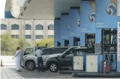  ?? Victor Besa / The National ?? On the first day of the self-service option yesterday, most Adnoc customers opted to fill their own tanks