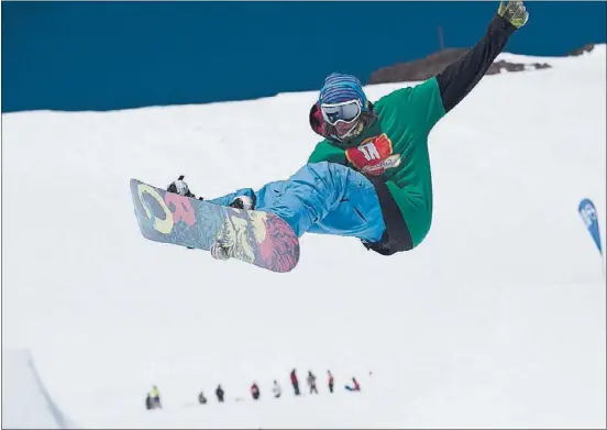  ?? MATT PALMER/ SQUAWVALLE­Y ?? A snowboarde­r hits the slopes at Squaw Valley. This is opening weekend for Squaw, which is introducin­g new high- speed lifts and upgrading its Olympic Plaza Bar.