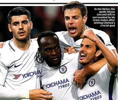  ??  ?? To the Victor, the spoils: Moses (second left) is surrounded by his team-mates after netting Chelsea’s crucial goal