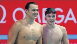  ??  ?? Victory Duncan Scott (right) celebrates his 4x200m freestyle relay win with team-mate Nick Grainger