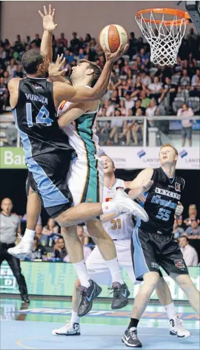  ?? Photo: FAIRFAX NZ ?? Doing it tough: Breakers forward Mika Vukona, left, shoots despite the attentions of Townsville Croc Ben Allen at Auckland’s North Shore Events Centre last night.