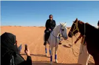  ?? Reuters file ?? A woman rides a horse at Al Reem Reserve camp, west of Riyadh, Saudi Arabia. —