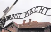  ?? ABACA PRESS ?? “Arbeit macht frei” (Labor will set you free) is posted above the entrance to Auschwitz I, the Nazi concentrat­ion camp in Auschwitz, Poland.