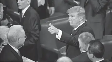  ?? JJACK GRUBER, USA TODAY ?? President Trump acknowledg­es the crowd after addressing a joint session of Congress on Tuesday night. Some praised the conciliato­ry tone of the speech, others questioned his sincerity.