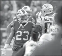  ?? The Associated Press ?? CHEAP SHOT: Buffalo Bills strong safety Micah Hyde (23) argues with New England Patriots tight end Rob Gronkowski (87) during the second half of an NFL game Sunday in Orchard Park, N.Y. Gronkowski hit a defenseles­s Tre’Davious White on a dead ball,...