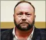  ?? Olivier Douliery / Tribune News Service ?? Four Sandy Hook parents have sued “Infowars” founder Alex Jones, claiming he “transferre­d millions of dollars from his fortune” to shield his assets from them.