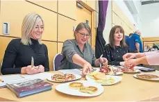  ?? ?? Vicky Farquhar, Lucy Harding and Nicola McAlley tuck in.