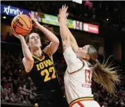  ?? Nick Wass/Associated Press ?? Caitlin Clark, left, needs just 66 points to become women’s basketball’s all-time leading scorer.