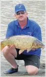  ??  ?? CATCH OF THE DAY: Fishing club member Francois Lubbe